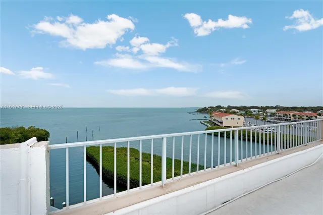 a outdoor space with lots of tables a garden view and chairs