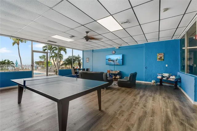 a view of a patio with swimming pool table and chairs