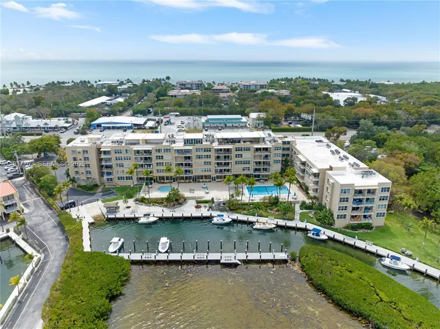 an aerial view of river residential houses with outdoor space