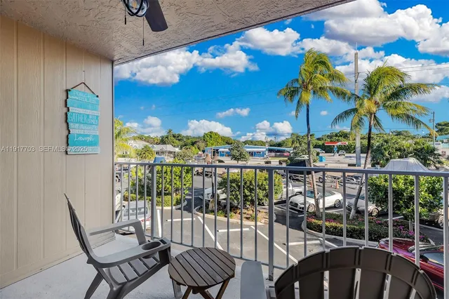 a view of a balcony with chairs