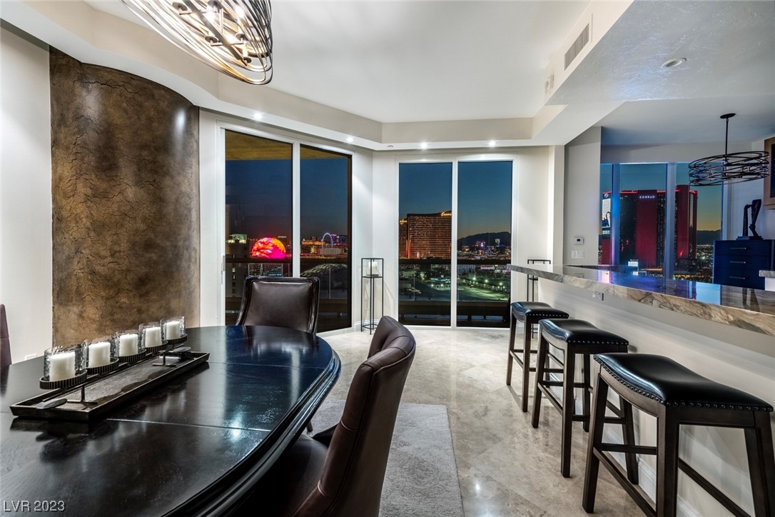 2857 Paradise Road, Unit 2303 Las Vegas, NV 89109 - Photo 18 of 37 DINING AND KITCHEN AREAS WITH SPECTACULAR VIEWS!!!