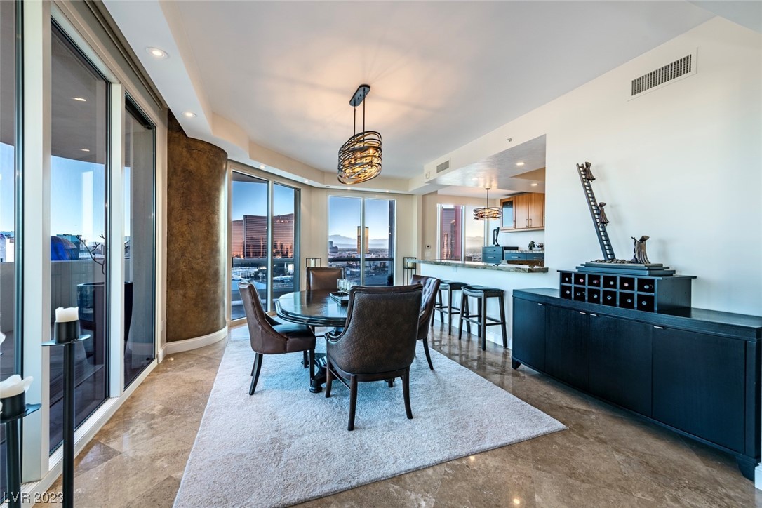 2857 Paradise Road, Unit 2303 Las Vegas, NV 89109 - Photo 4 of 37 DINING AREA WITH RENOVATED OPEN KITCHEN AREA!!!