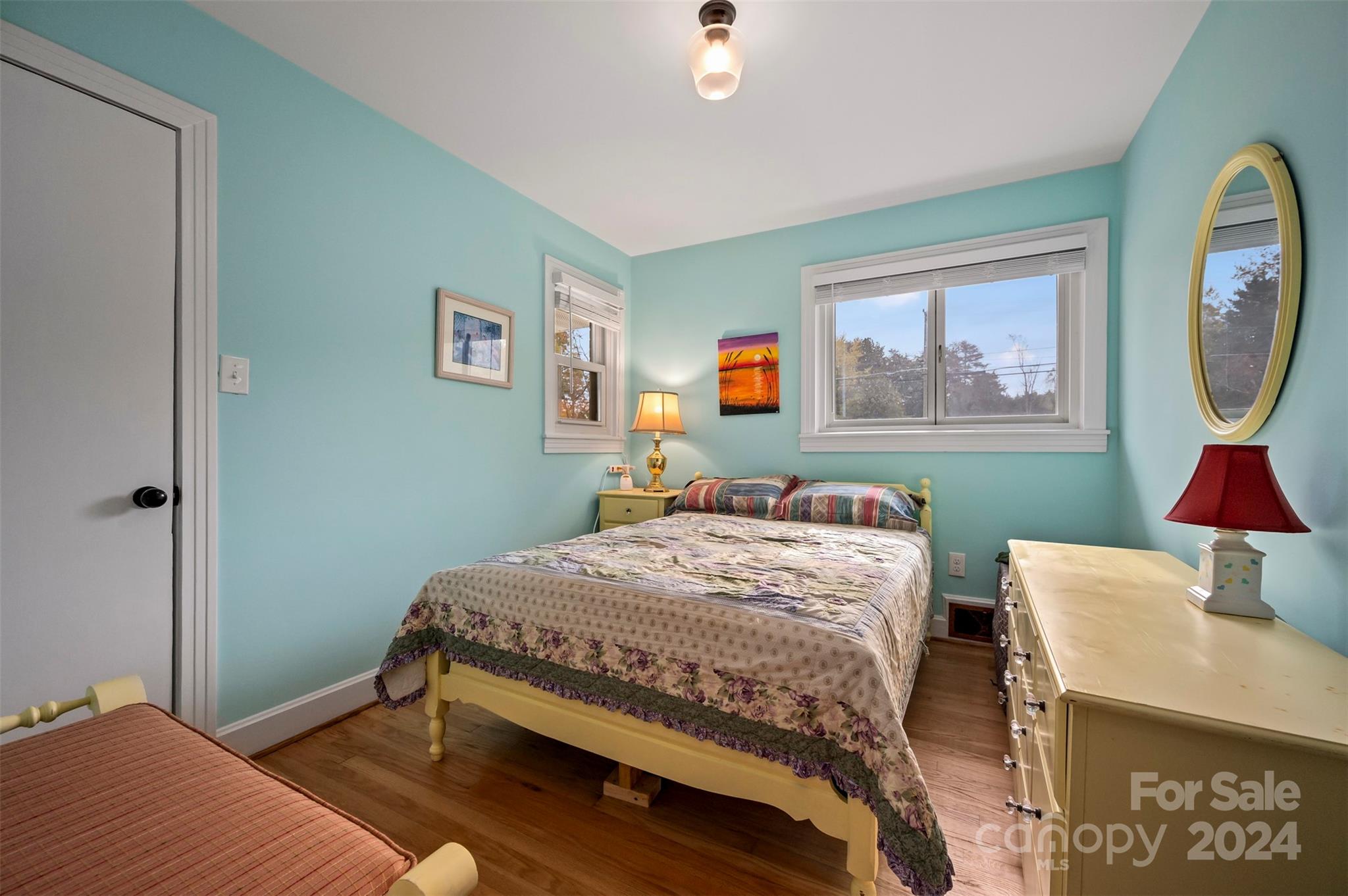 690-684 Chimney Rock Road Rutherfordton, NC 28139 - Photo 26 of 39 a bedroom with a bed and painting on the wall