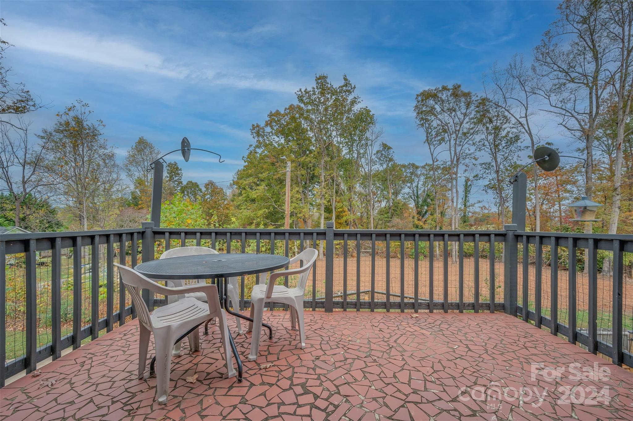 690-684 Chimney Rock Road Rutherfordton, NC 28139 - Photo 28 of 39 a view of a balcony with two chairs and a table