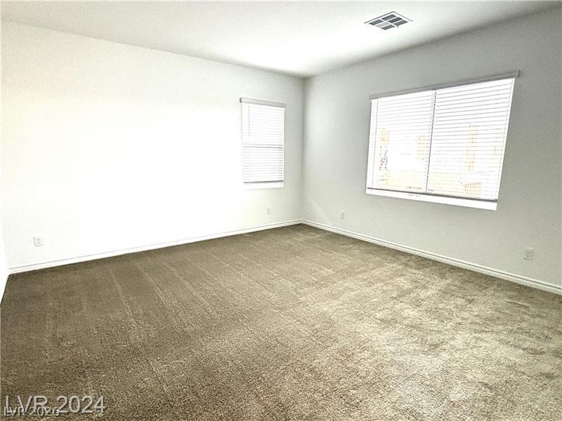 8336 Rowan Rdg Avenue Las Vegas, NV 89147 - Photo 8 of 15 This spacious room features ample natural light, ideal for a comfortable lifestyle.