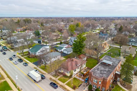 an aerial view of residential houses with outdoor space