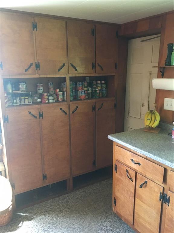 411 Ellis River Road Rumford, ME 04276 - Photo 14 of 26 Kitchen has many cabinets for an in...