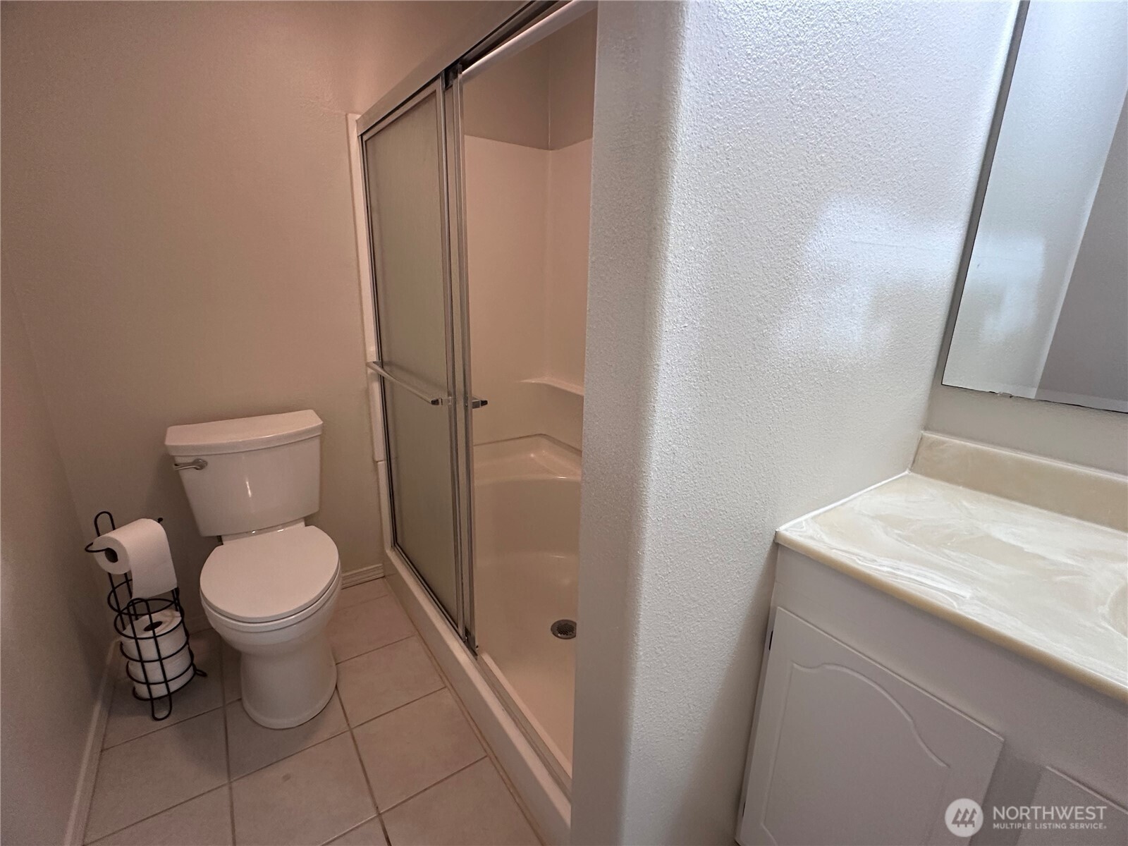 1301 South 3rd Avenue, Unit 7D Sequim, WA 98382 - Photo 12 of 32 a bathroom with a toilet and a sink