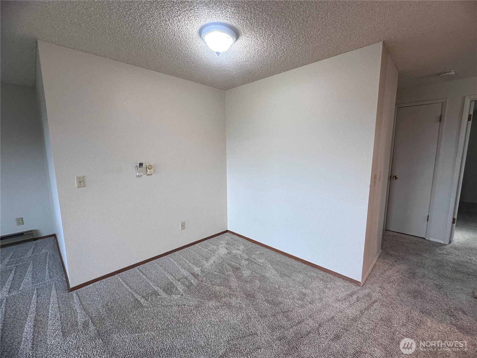 1301 South 3rd Avenue, Unit 7D Sequim, WA 98382 - Photo 17 of 32 an empty room with a bench
