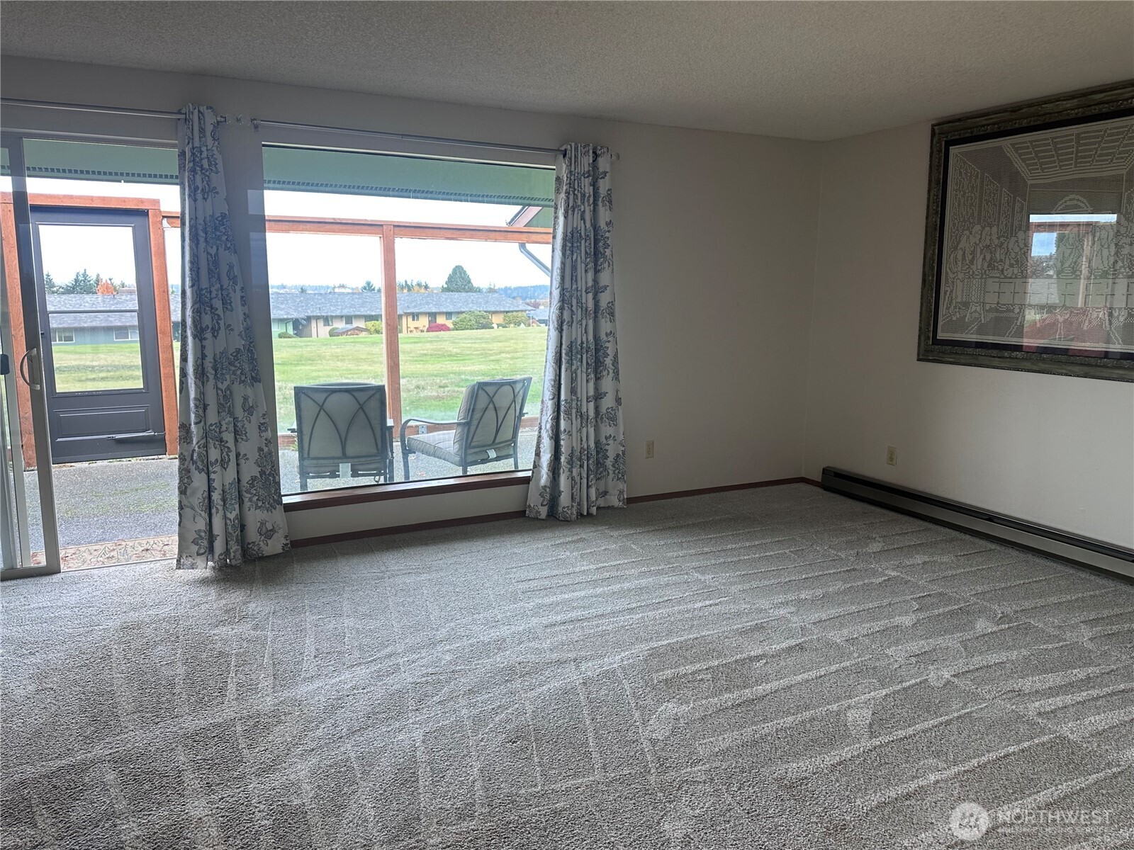 1301 South 3rd Avenue, Unit 7D Sequim, WA 98382 - Photo 19 of 32 a view of an empty room with a balcony