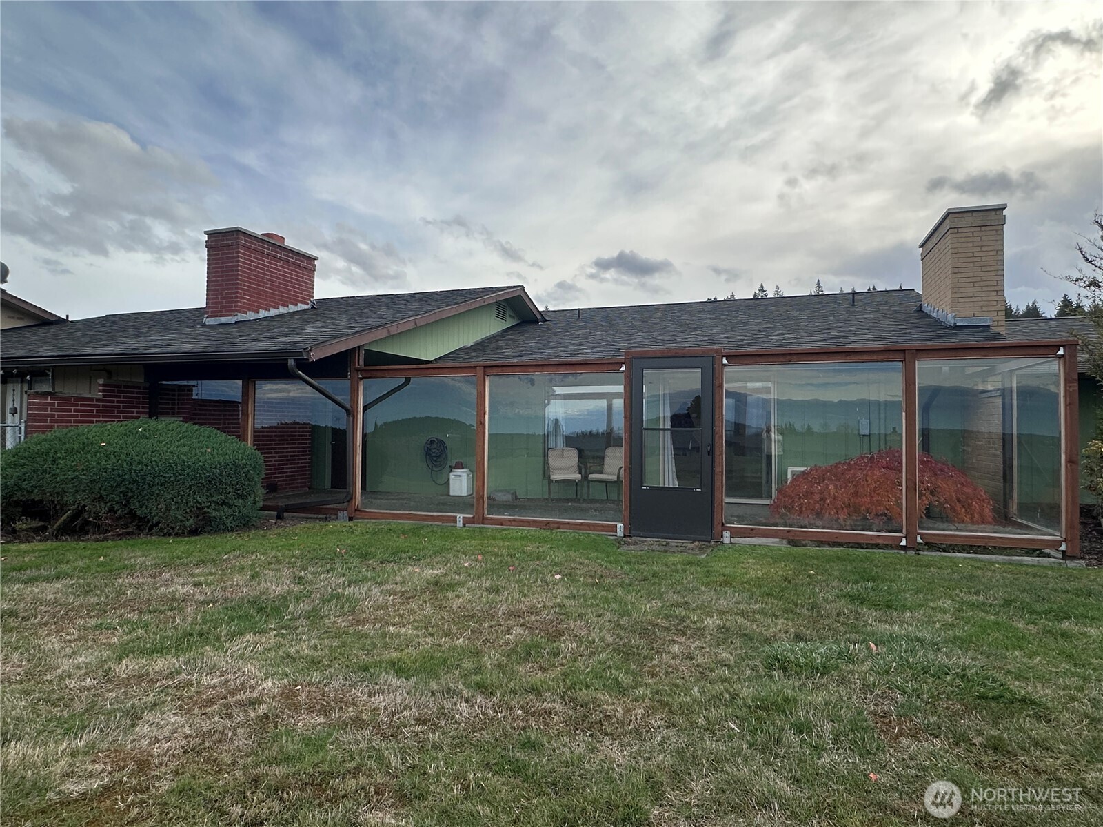 1301 South 3rd Avenue, Unit 7D Sequim, WA 98382 - Photo 30 of 32 front view of a house with a yard
