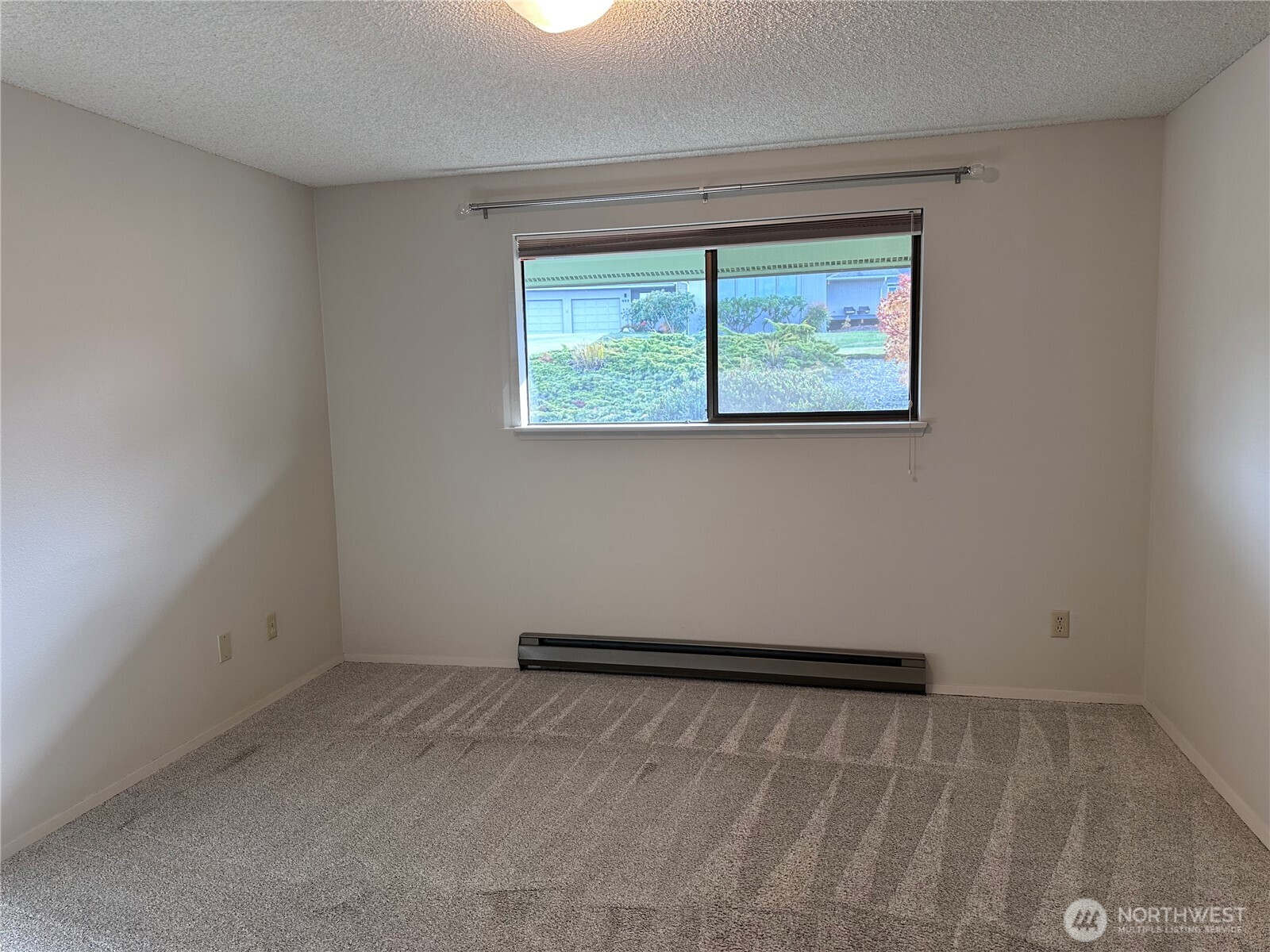 1301 South 3rd Avenue, Unit 7D Sequim, WA 98382 - Photo 8 of 32 an empty room with a window