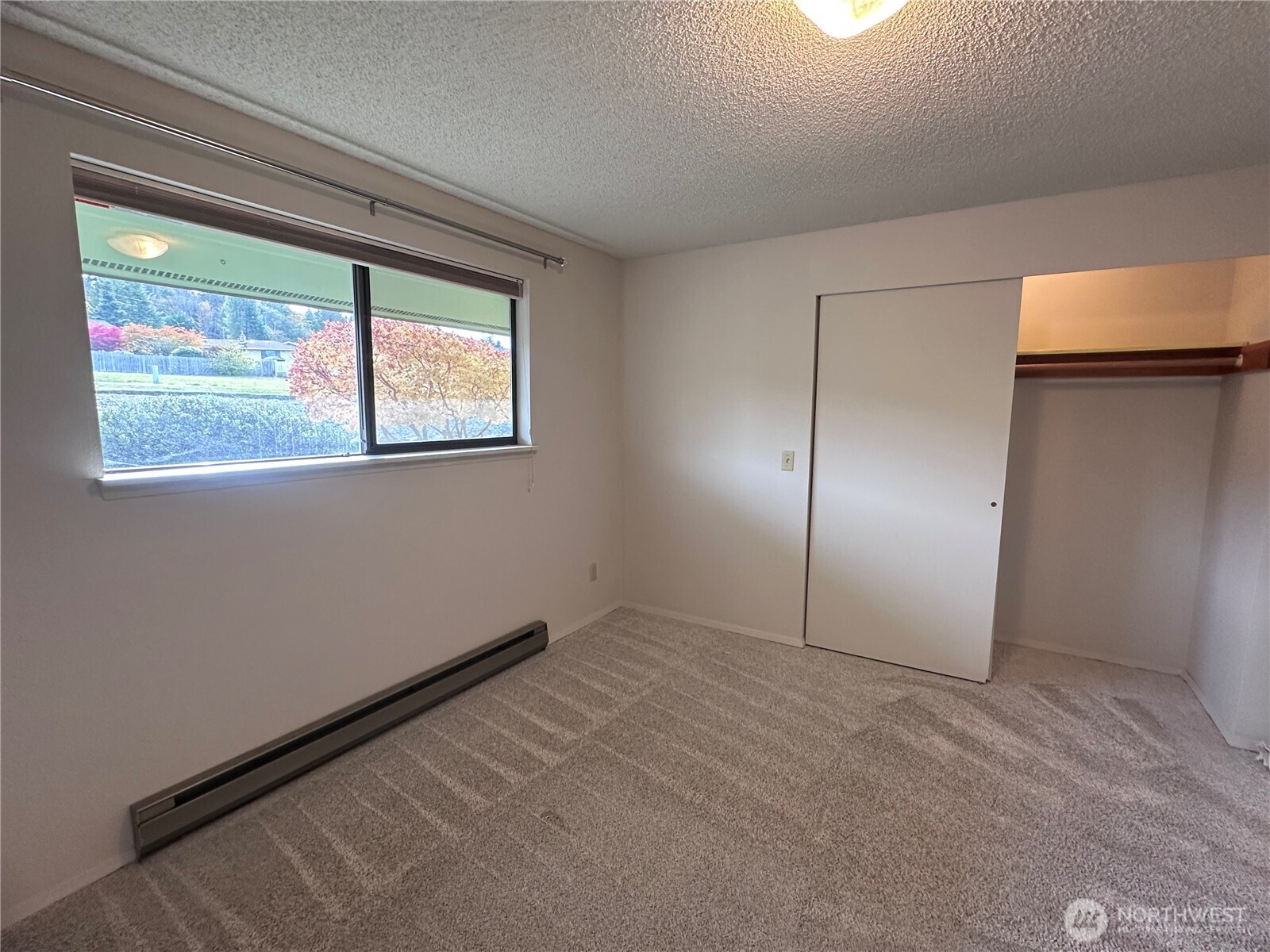 1301 South 3rd Avenue, Unit 7D Sequim, WA 98382 - Photo 9 of 32 an empty room with windows and closet