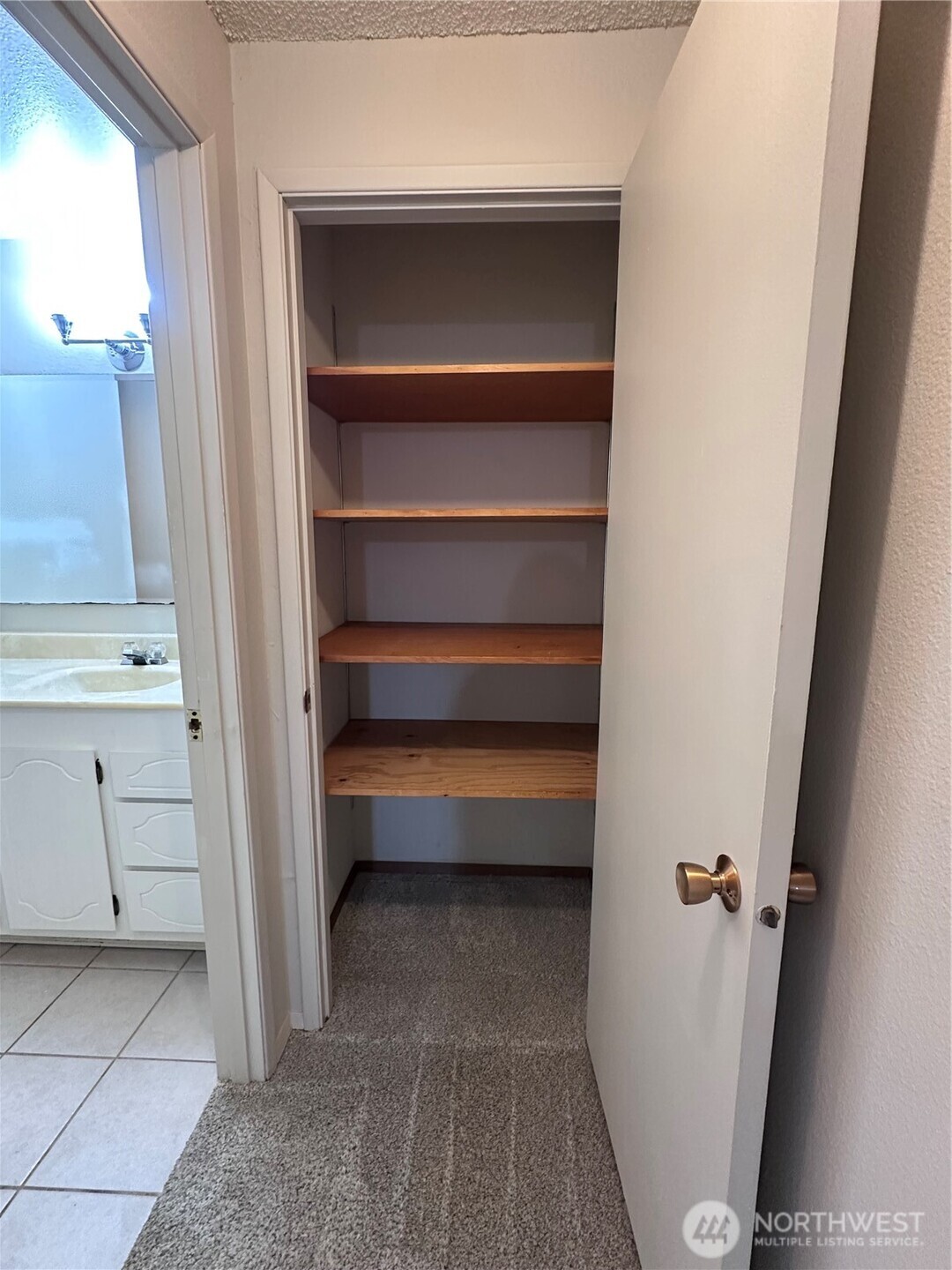 1301 South 3rd Avenue, Unit 7D Sequim, WA 98382 - Photo 10 of 32 a view of walk in closet with empty racks