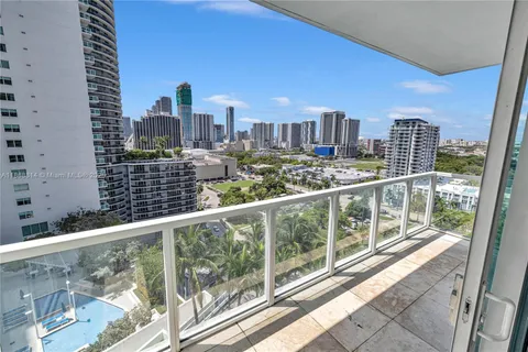 a view of a city skyline from a balcony