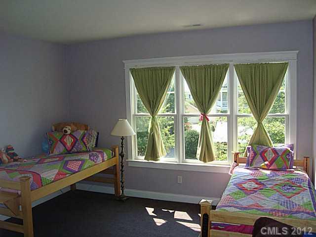 6169 Caseys Side Way Fort Mill, SC 29708 - Photo 7 of 13 a bedroom with a bed and a window