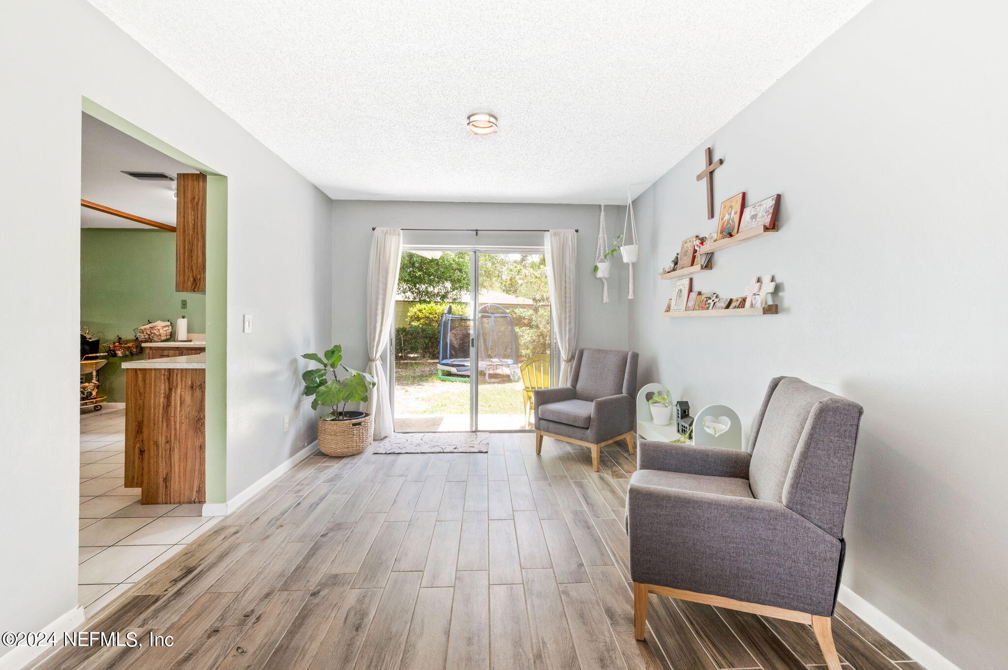 281 Trillo Street St. Augustine, FL 32086 - Photo 11 of 41 a living room with furniture and a wooden floor