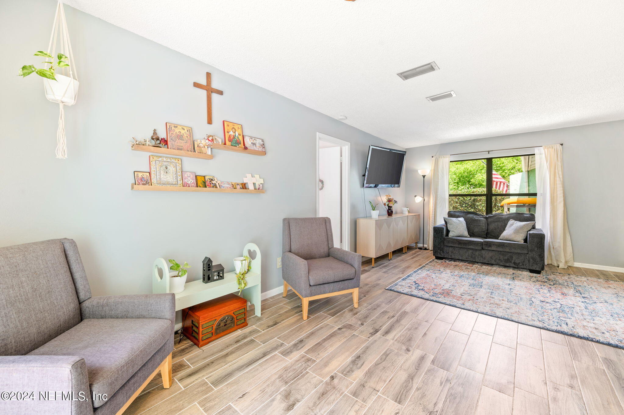 281 Trillo Street St. Augustine, FL 32086 - Photo 12 of 41 a living room with furniture and a couch
