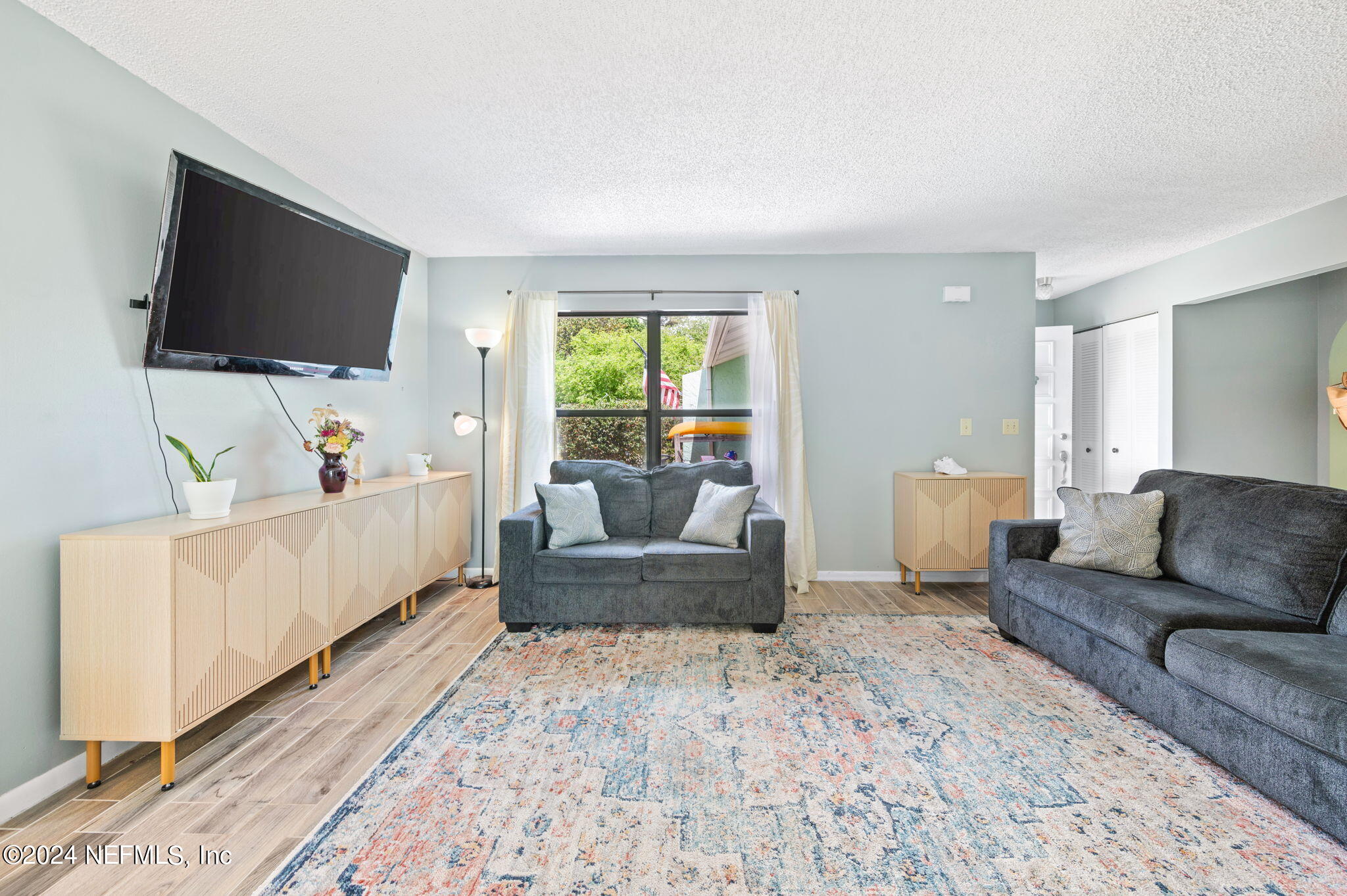 281 Trillo Street St. Augustine, FL 32086 - Photo 13 of 41 a living room with furniture and a flat screen tv