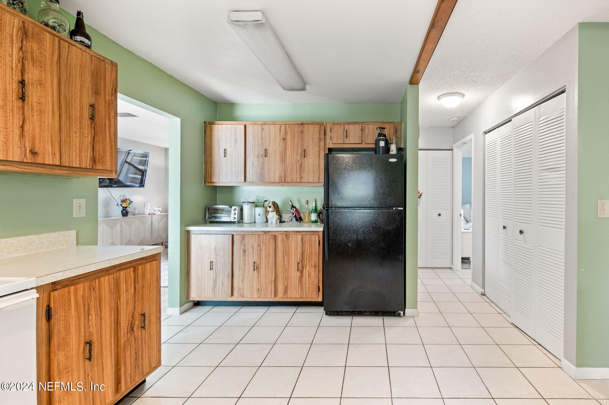 281 Trillo Street St. Augustine, FL 32086 - Photo 15 of 41 a kitchen with stainless steel appliances a refrigerator sink and cabinets