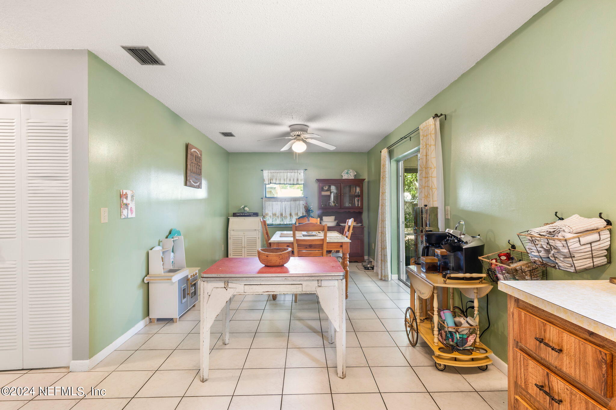 281 Trillo Street St. Augustine, FL 32086 - Photo 17 of 41 a bedroom with furniture and a mirror