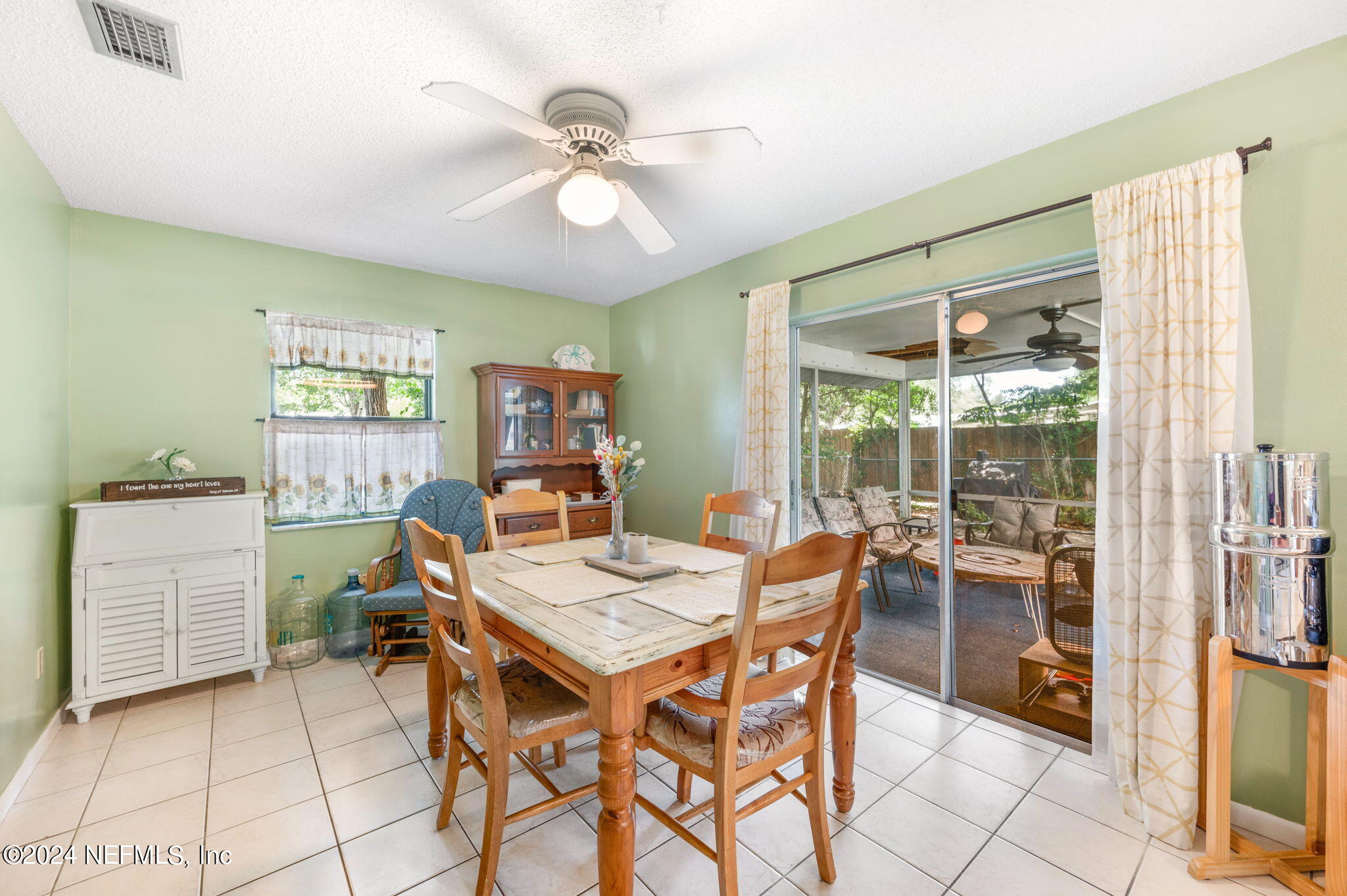281 Trillo Street St. Augustine, FL 32086 - Photo 18 of 41 a view of a dining room with furniture window and outside view