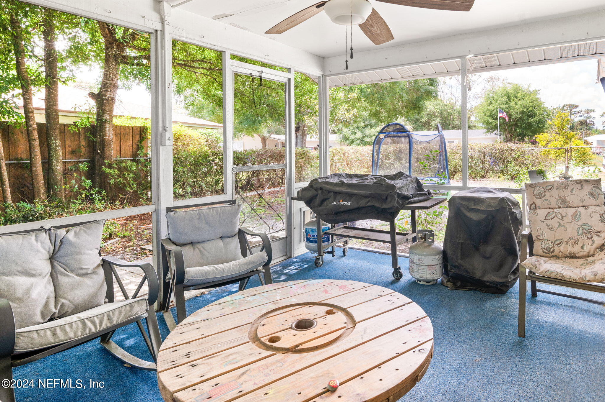 281 Trillo Street St. Augustine, FL 32086 - Photo 20 of 41 a living room with patio furniture and a large window