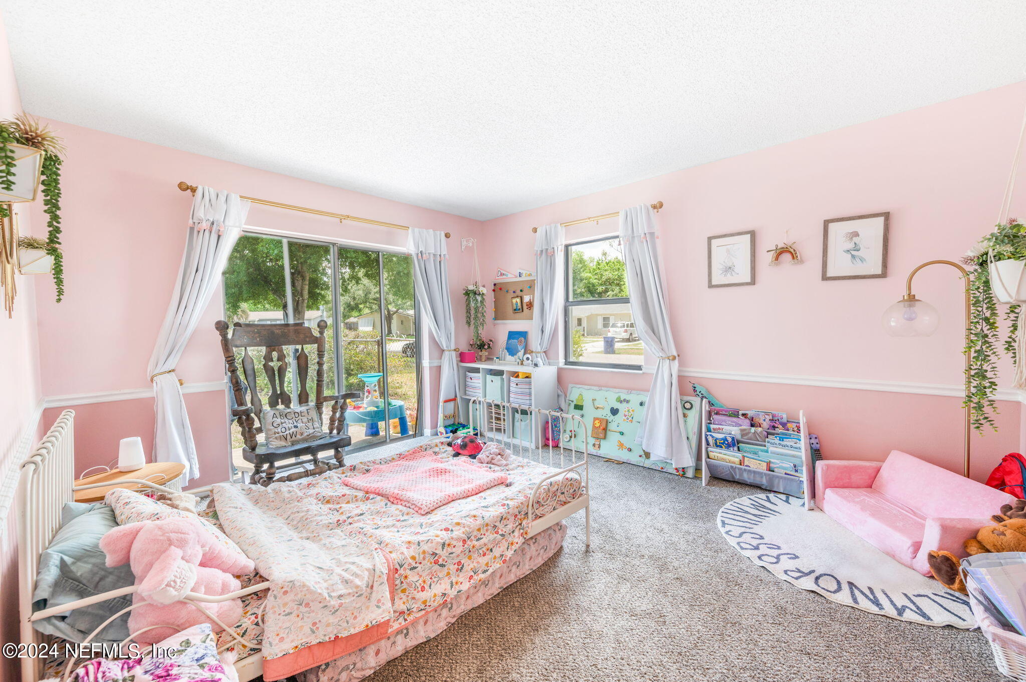 281 Trillo Street St. Augustine, FL 32086 - Photo 21 of 41 a bedroom with a bed and a large window