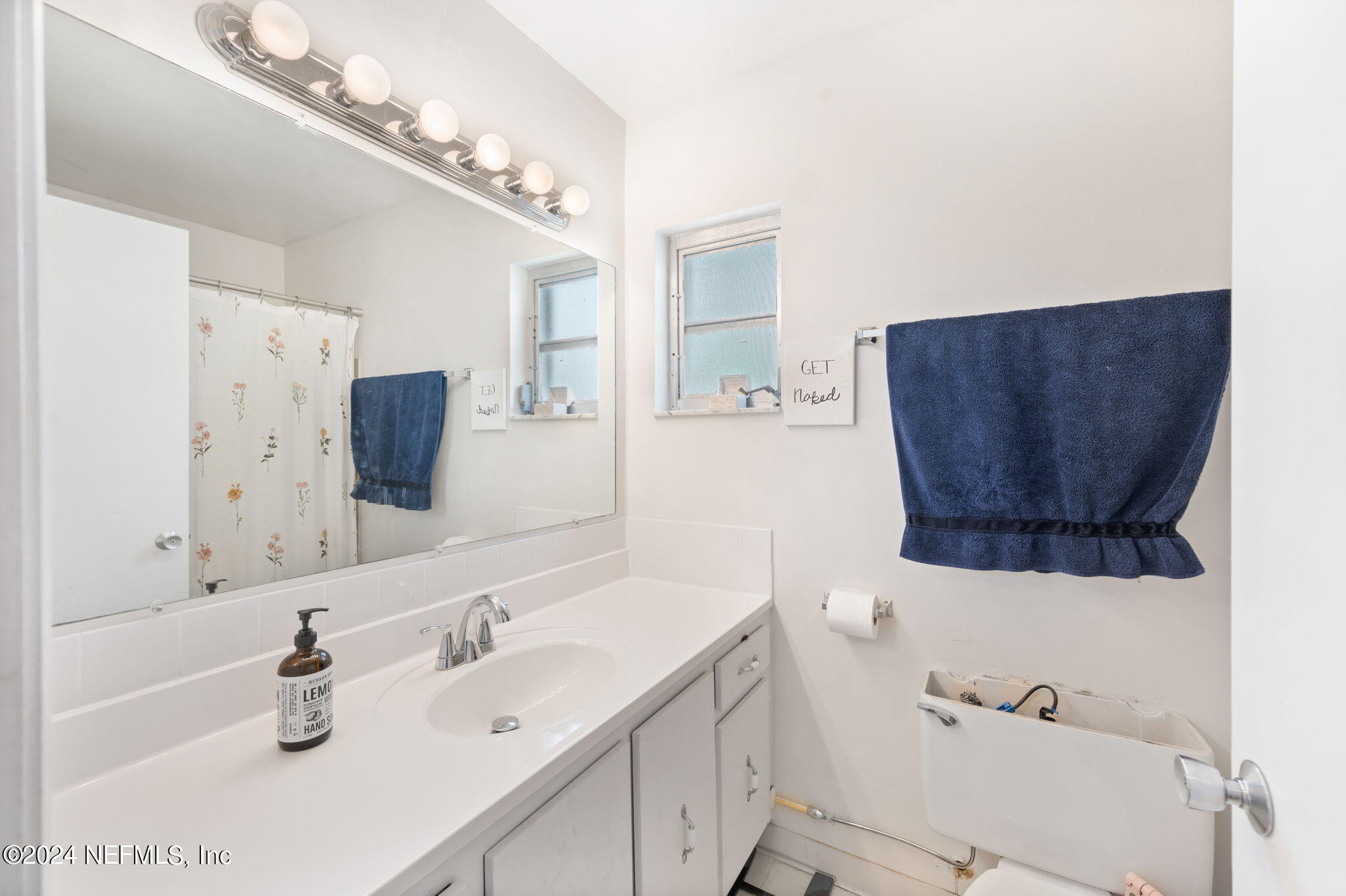 281 Trillo Street St. Augustine, FL 32086 - Photo 26 of 41 a bathroom with a sink and a mirror