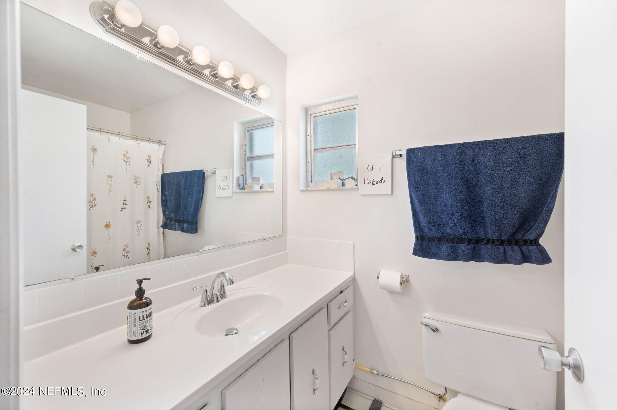 281 Trillo Street St. Augustine, FL 32086 - Photo 27 of 41 a bathroom with a sink and a mirror