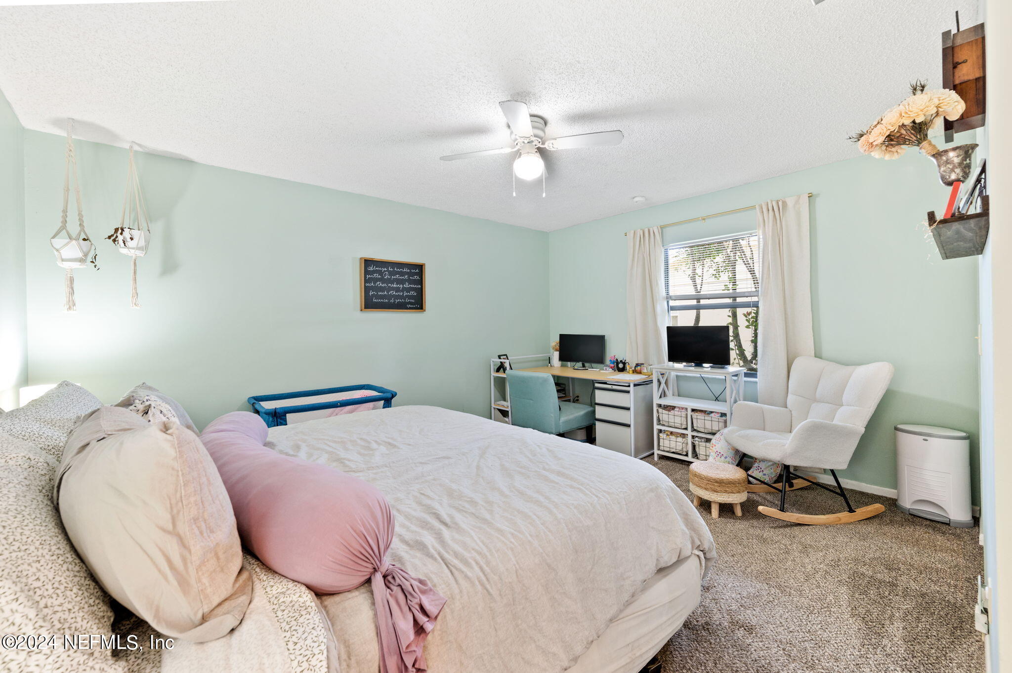 281 Trillo Street St. Augustine, FL 32086 - Photo 29 of 41 a bed room with a bed a chair and potted plant