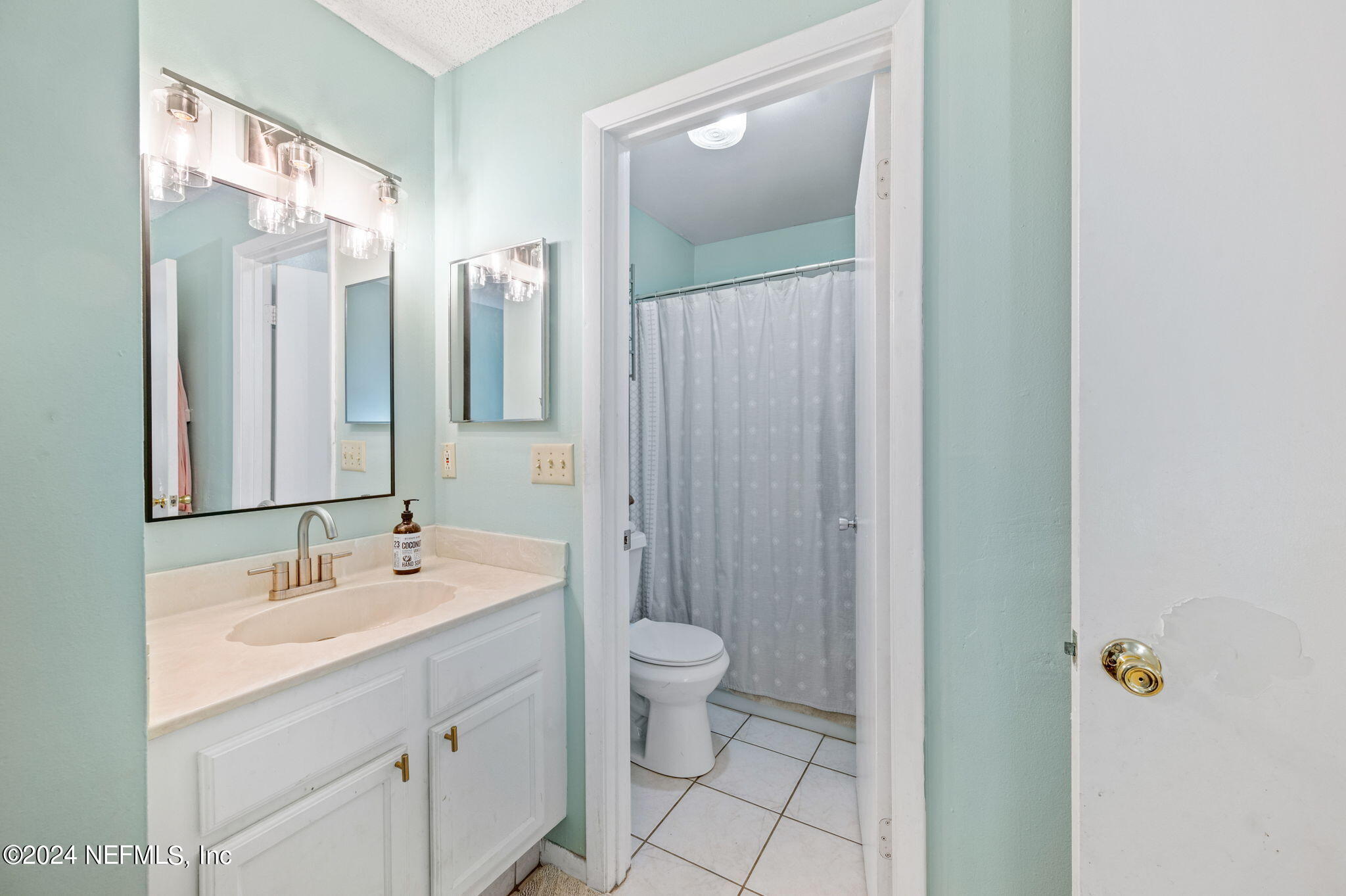 281 Trillo Street St. Augustine, FL 32086 - Photo 30 of 41 a bathroom with a double vanity sink toilet and shower