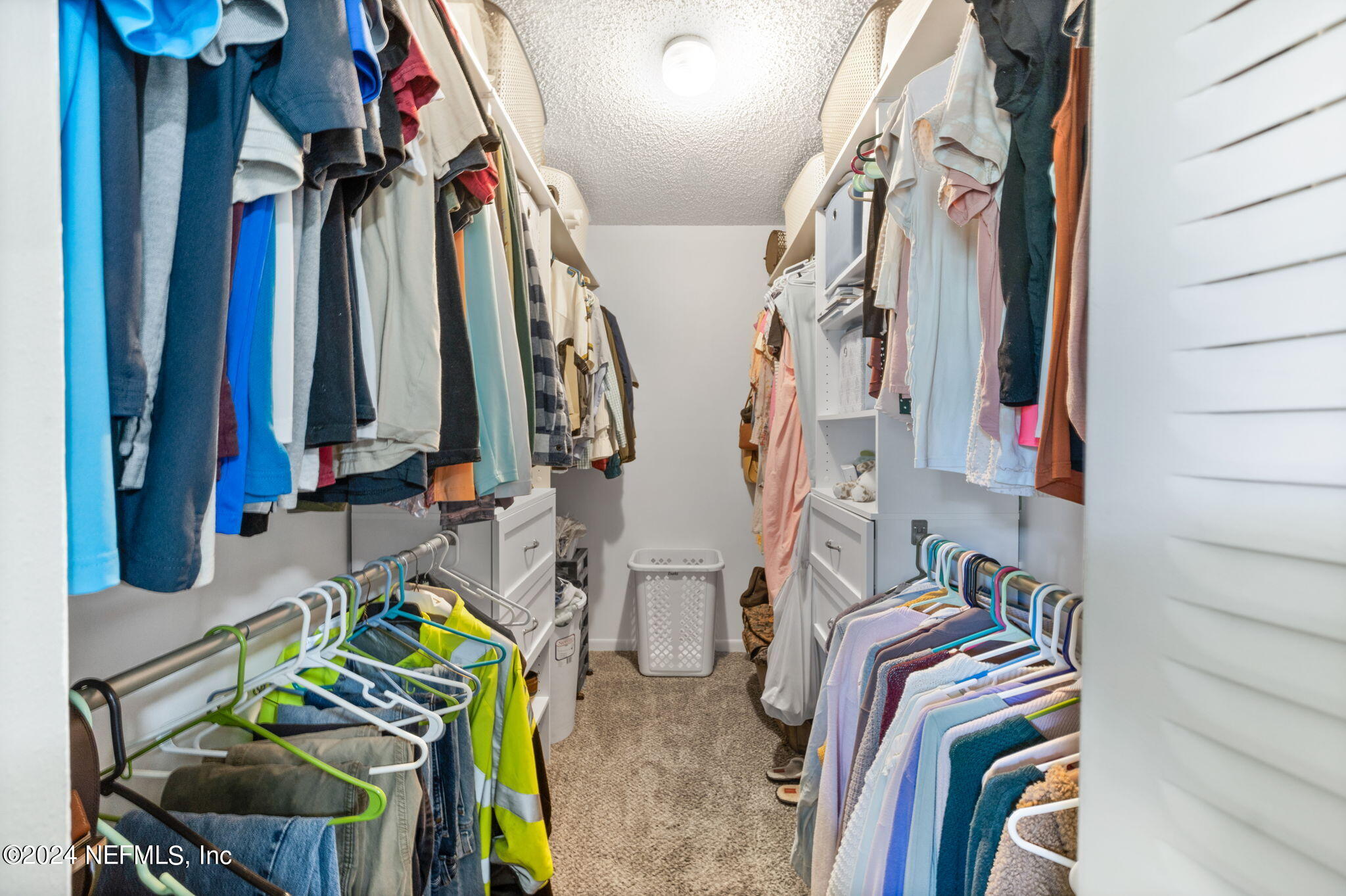 281 Trillo Street St. Augustine, FL 32086 - Photo 32 of 41 a view of walk in closet with clothes and shoes