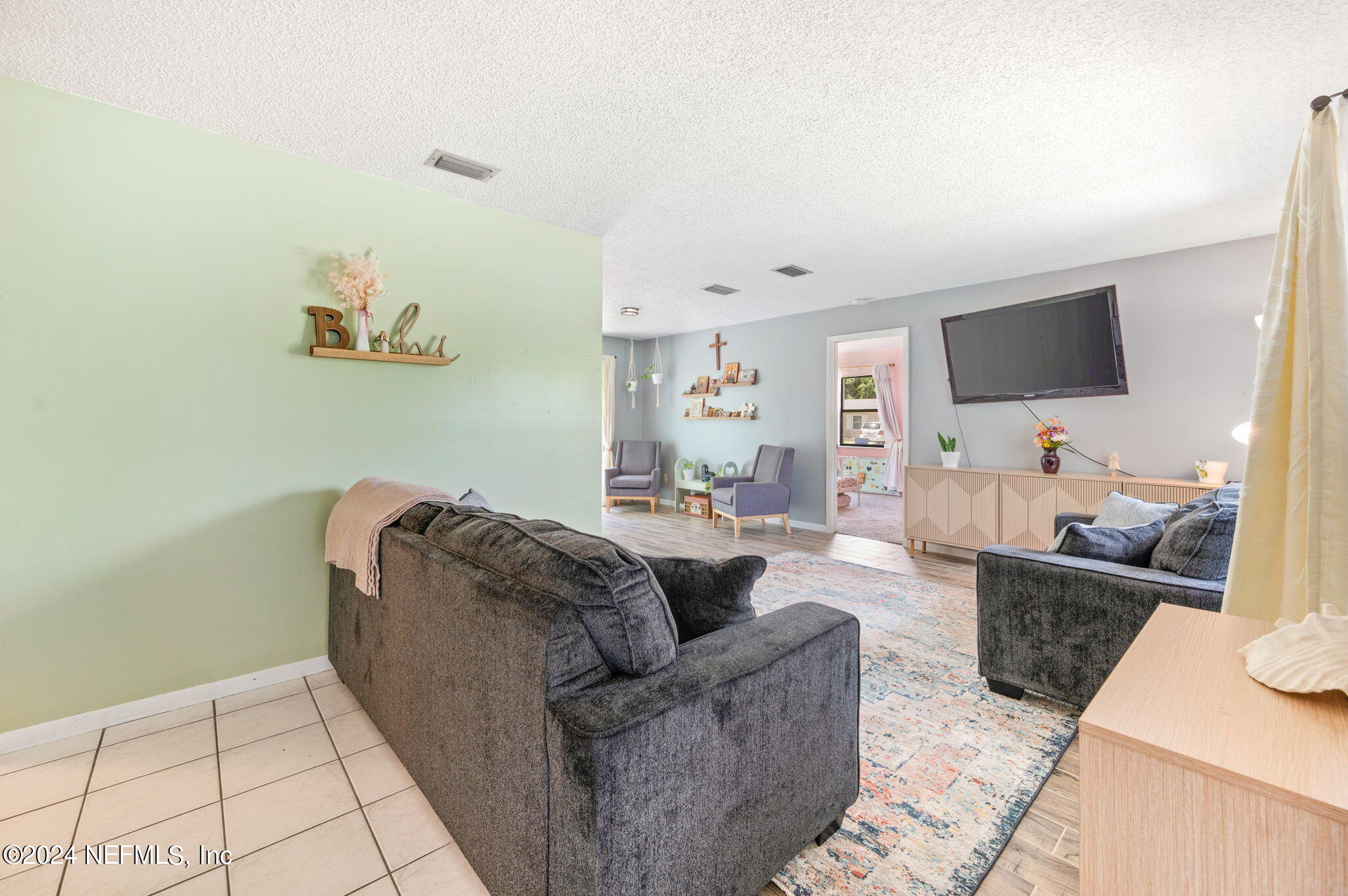281 Trillo Street St. Augustine, FL 32086 - Photo 7 of 41 a living room with furniture and a flat screen tv