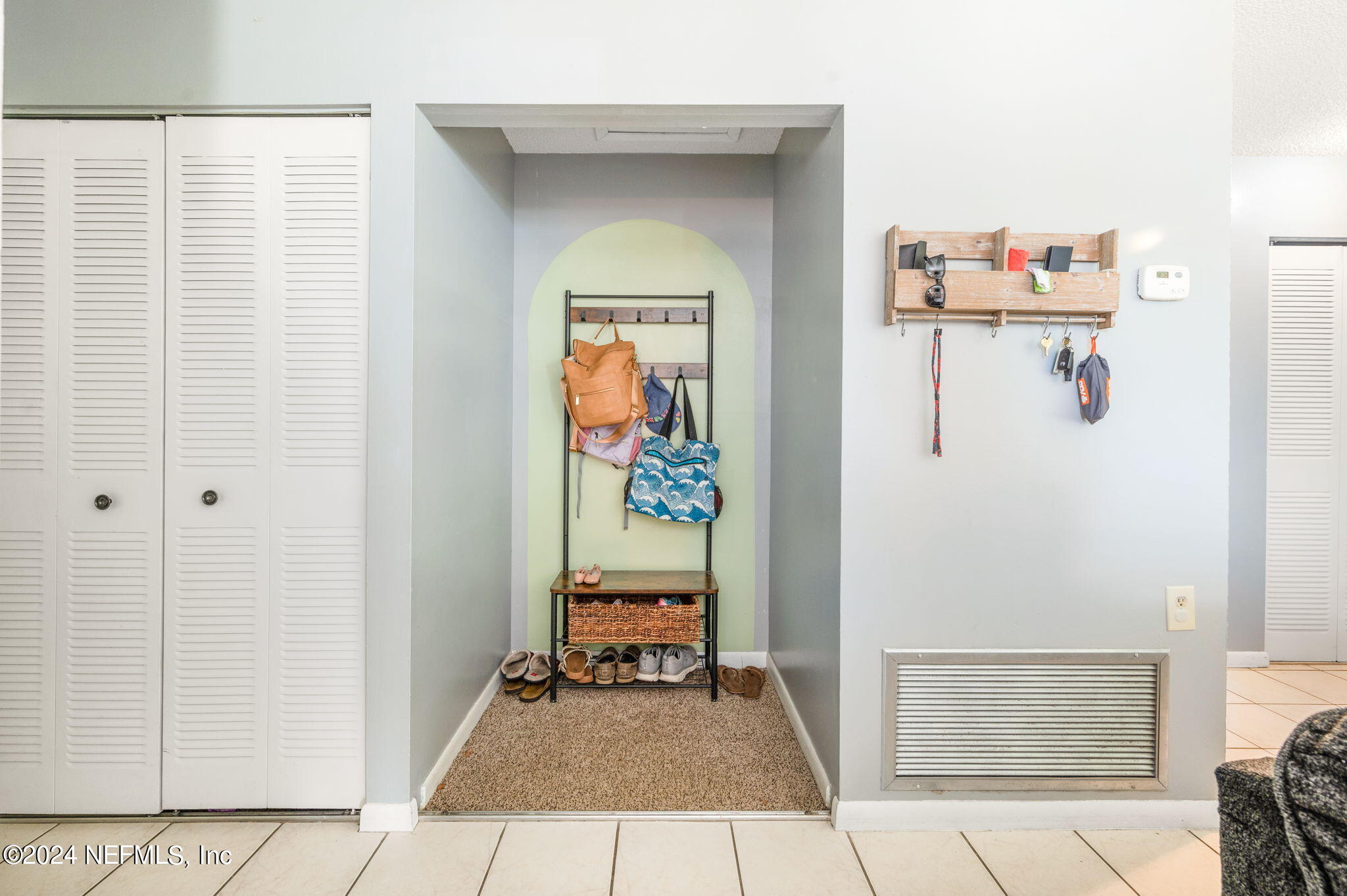 281 Trillo Street St. Augustine, FL 32086 - Photo 9 of 41 a hallway with painting and a table