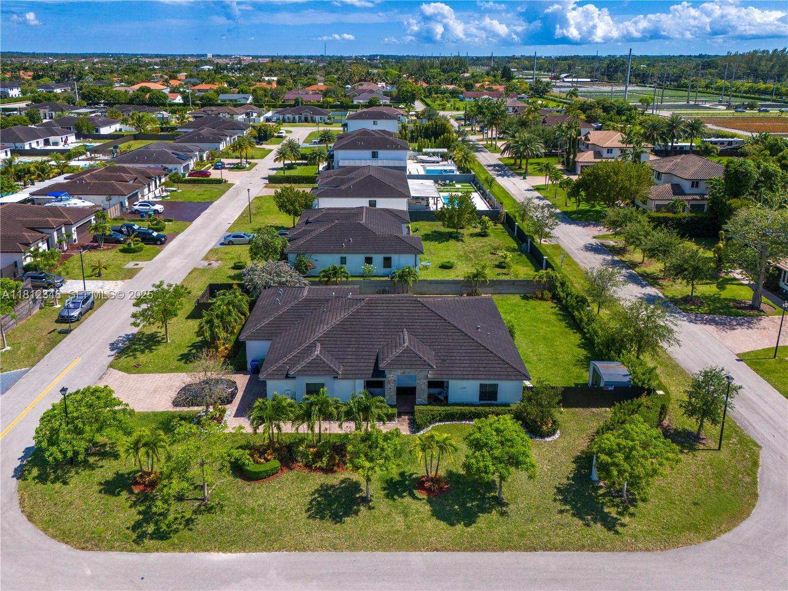 21342 Southwest 132nd Place Miami, FL 33177 - Photo 3 of 16 an aerial view of a house with a garden