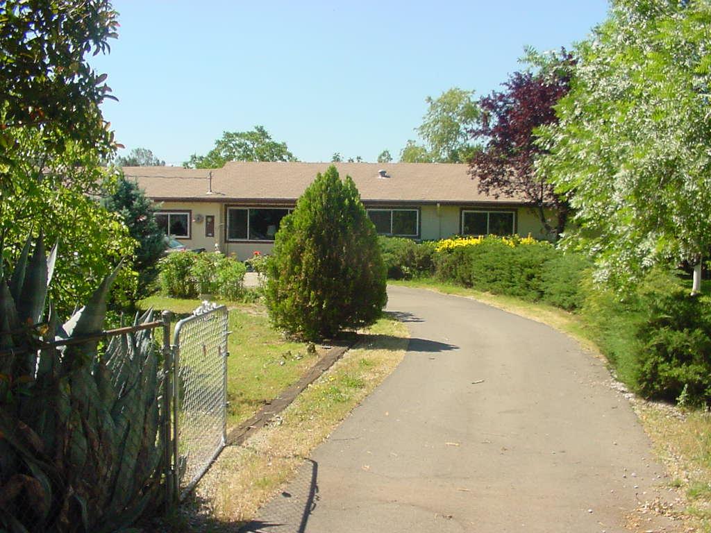 3273 Rancho Road Redding, CA 96002 - Photo 1 of 3 a view of a house with a yard