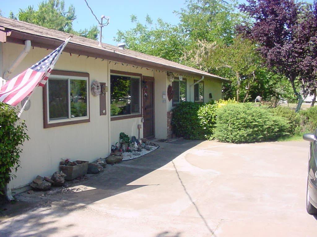 3273 Rancho Road Redding, CA 96002 - Photo 2 of 3 a front view of a house with garden