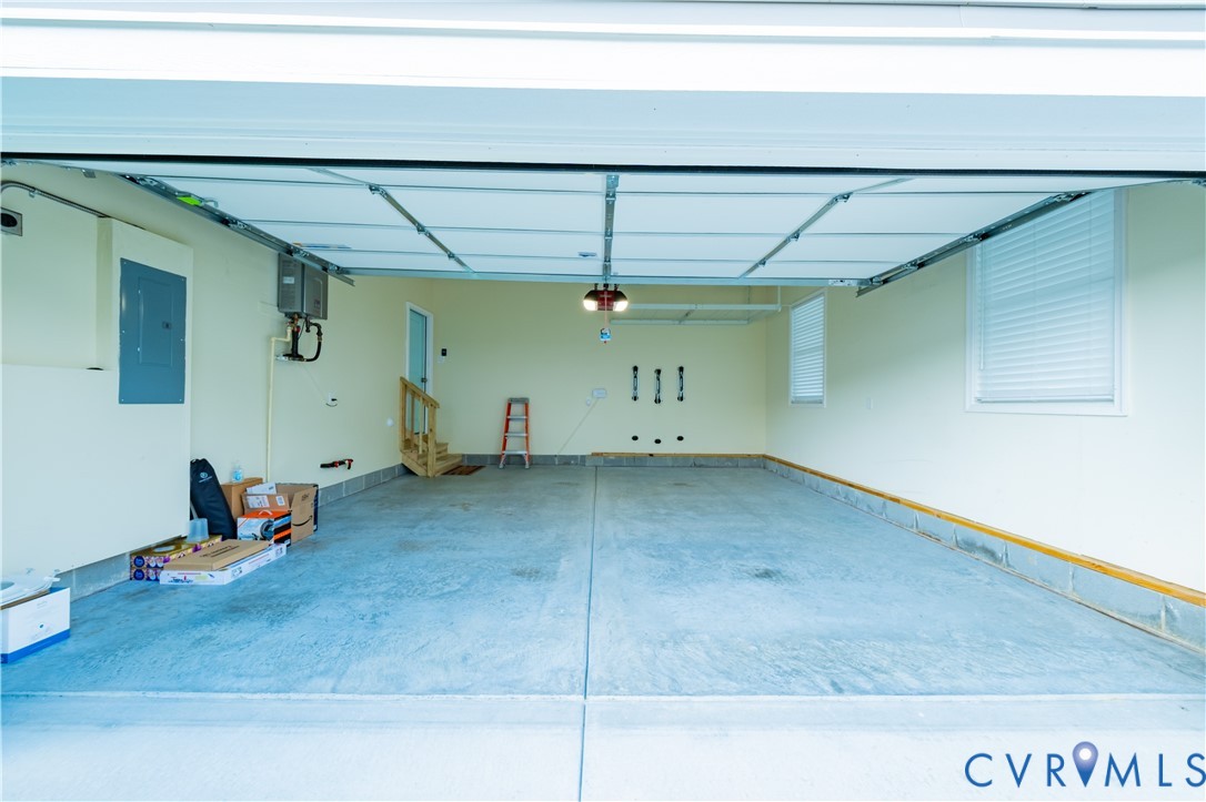 15607 Crowden Road Chesterfield, VA 23832 - Photo 25 of 57 Spacious garage with a concrete floor, overhead li