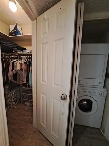 a view of a storage and utility room with washer and dryer