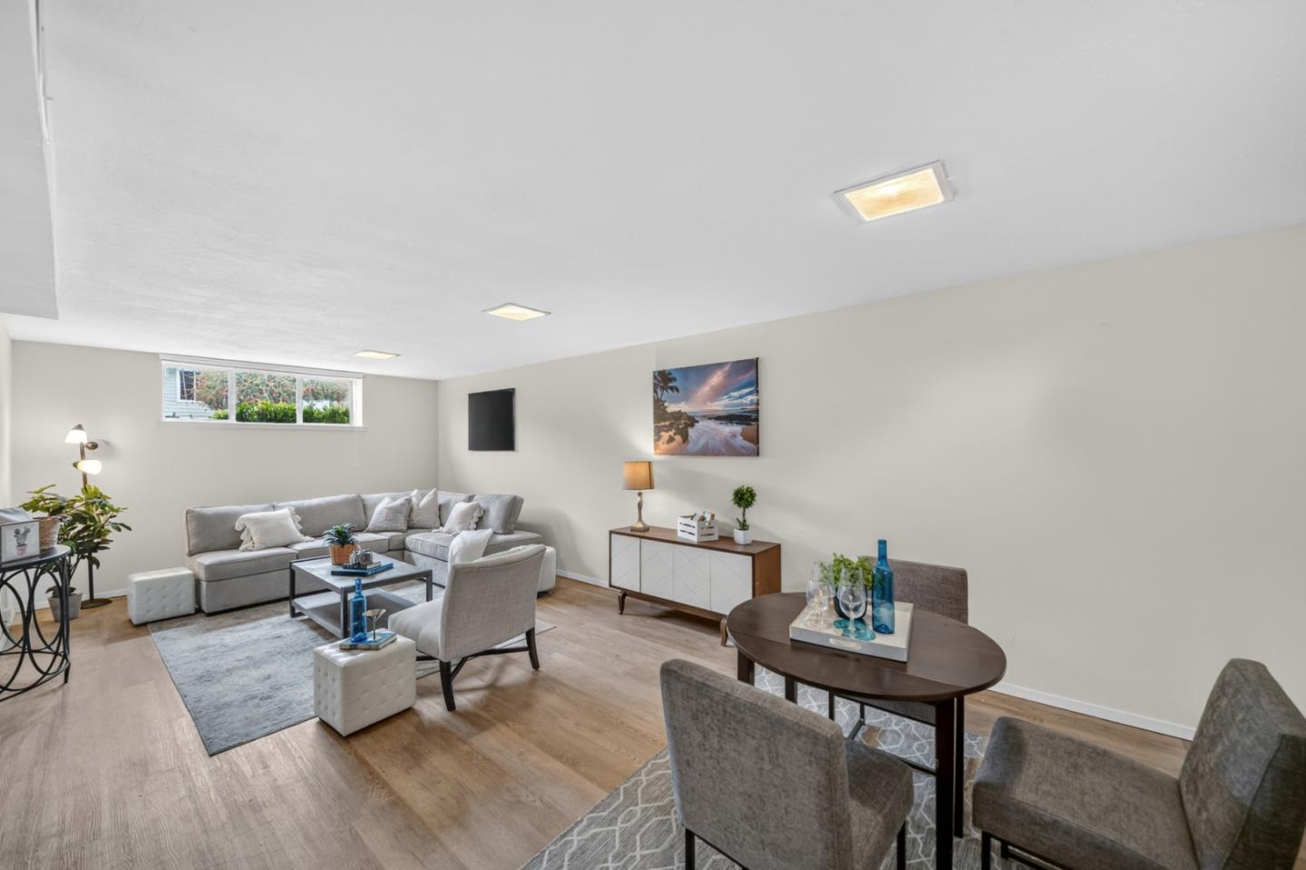 1287 Lerida Way Pacifica, CA 94044 - Photo 40 of 52 a living room with furniture and wooden floor