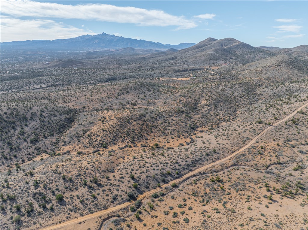 10700 Rodeo Drive Kingman, AZ 86401 - Photo 2 of 11 a view of a dry field with mountains in the background