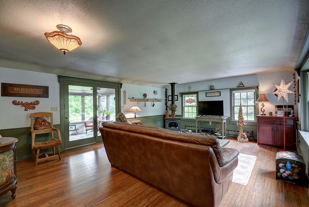 134 Brimfield Road Monson, MA 01057 - Photo 14 of 27 a living room with furniture and a flat screen tv