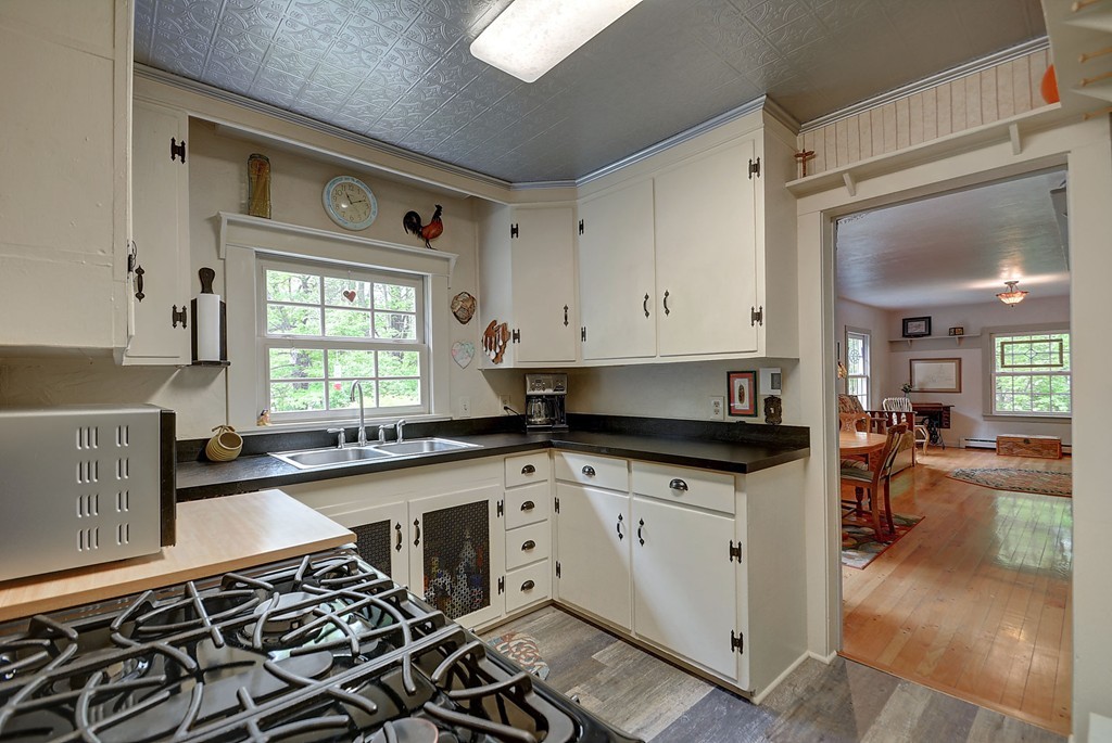 134 Brimfield Road Monson, MA 01057 - Photo 15 of 27 a kitchen with stainless steel appliances a stove a sink and a microwave