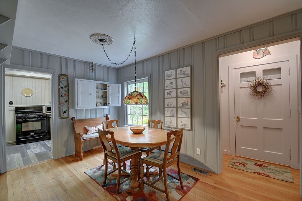 134 Brimfield Road Monson, MA 01057 - Photo 19 of 27 a view of a dining room with furniture and a chandelier
