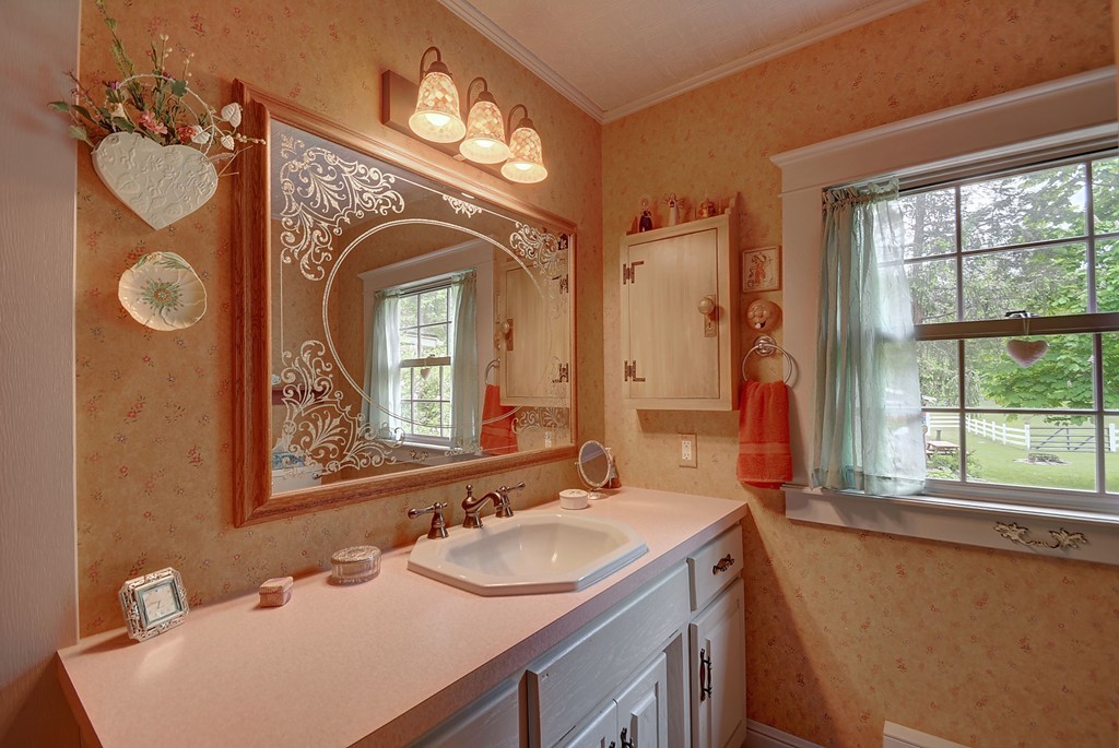 134 Brimfield Road Monson, MA 01057 - Photo 24 of 27 a bathroom with a sink and a mirror