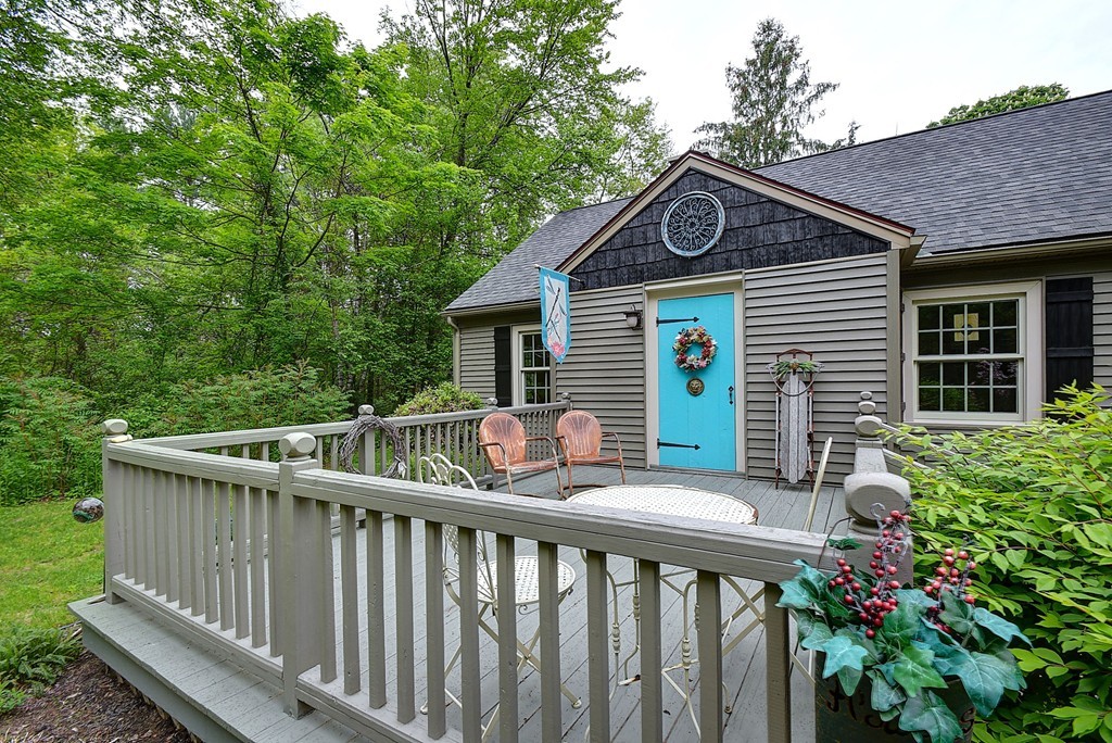 134 Brimfield Road Monson, MA 01057 - Photo 26 of 27 a view of a house with a small yard and wooden fence