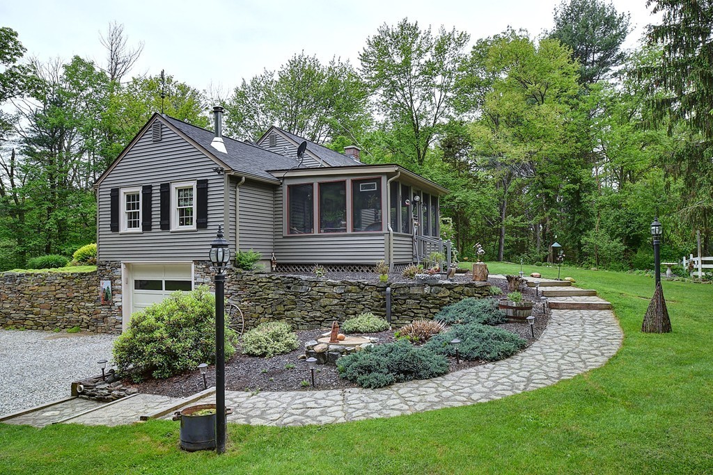 134 Brimfield Road Monson, MA 01057 - Photo 5 of 27 a front view of a house with a yard and fence