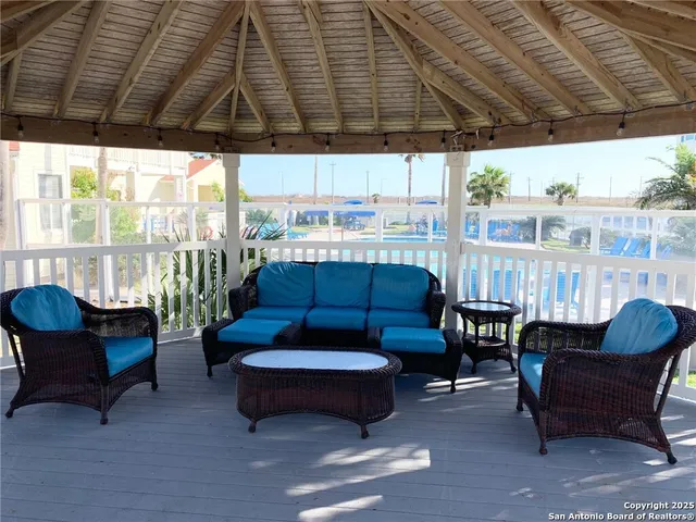 a view of a bench in patio with a yard
