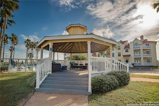 a view of a swimming pool with a yard
